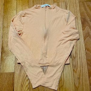 COPY - A cropped long sleeve shirt.
